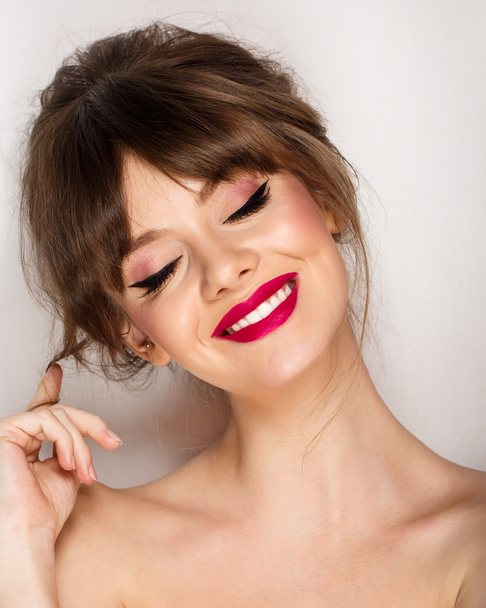 Woman face with hair motion pink lipstick, smile - Zdjęcie, obraz