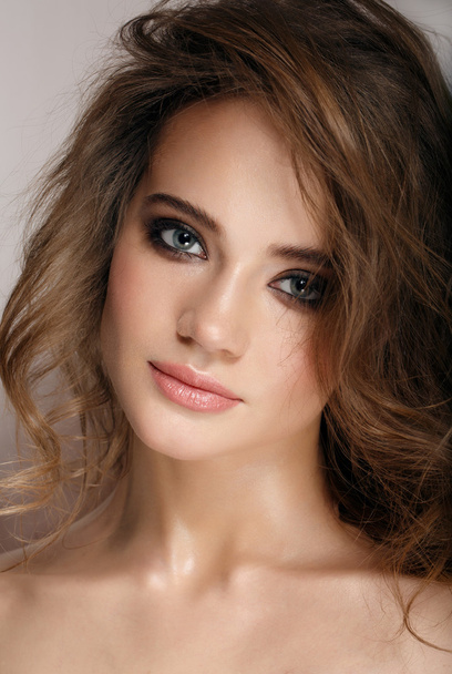 Glamour portrait of beautiful woman model with fresh daily makeup and romantic wavy hairstyle. - Фото, изображение