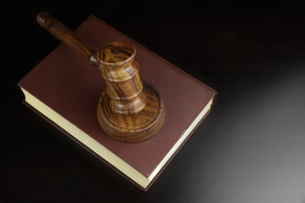 Judges Or Auctioneers Gavel And Red Book On Black Table - 写真・画像