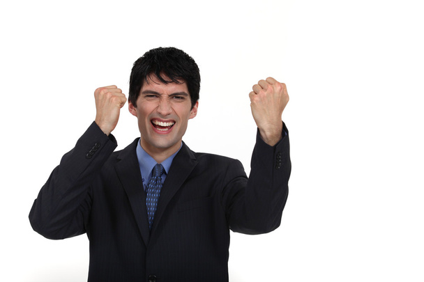 A businessman gesturing victory. - Photo, Image