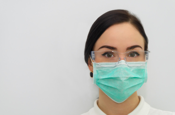 A beautiful dental assistant looking at the camera - Photo, Image
