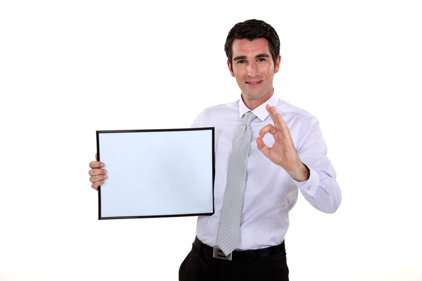 Man holding picture frame making OK gesture - Foto, Bild