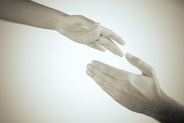 Hands reaching toward each other - Фото, зображення