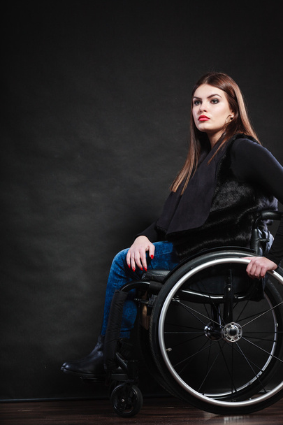 Sad woman sitting on wheelchair - 写真・画像