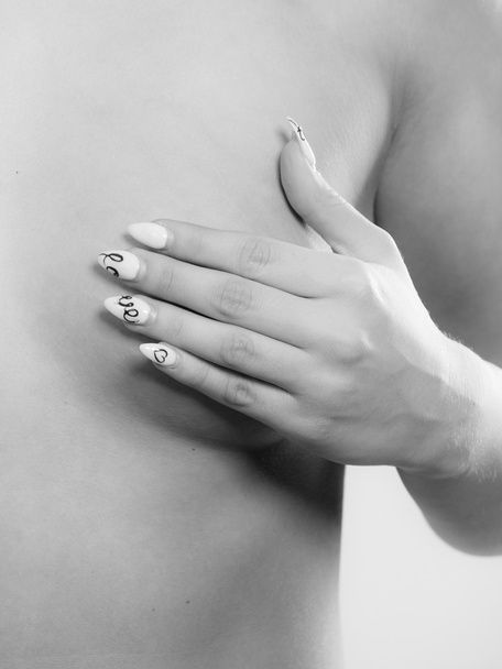 Mujer examinando sus pechos
 - Foto, Imagen