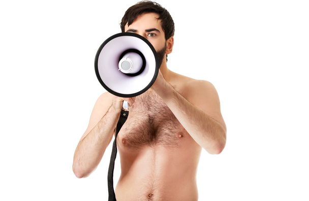 Shirtless man shouting using a megaphone. - Foto, Imagen