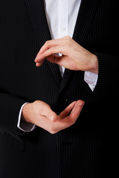 Businessman showing the size with hands. - Photo, image