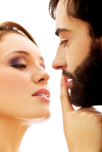 Parmağını koyarak kadın adamın dudakları - Fotoğraf, Görsel