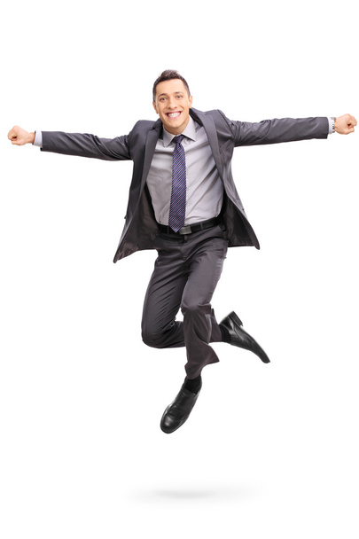 Businessman jumping out of happiness  - Foto, Bild