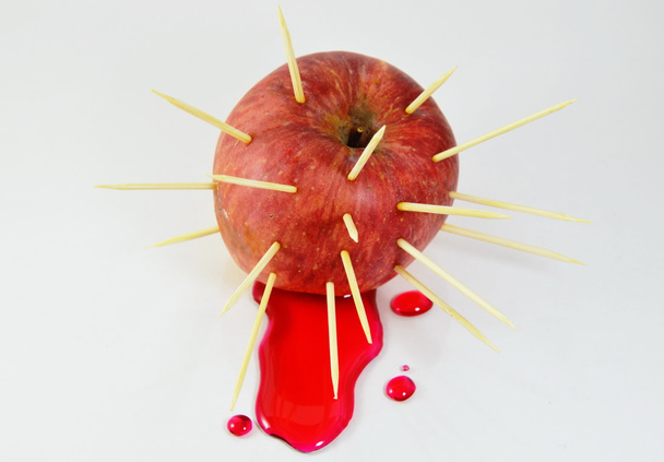 toothpicks stab on apple with red liquid flow - Zdjęcie, obraz