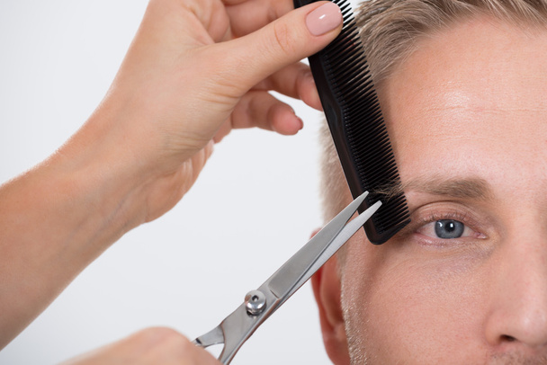 Man Getting His Eyebrow Trimmed - Photo, Image