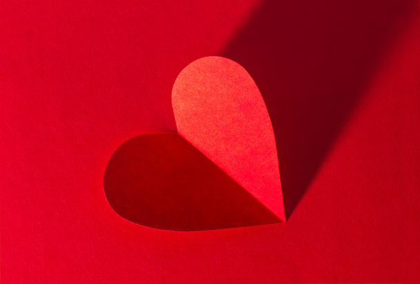 Paper heart on red background - Photo, Image
