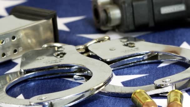 Handcuffs and ammunition on United States Flag - Filmagem, Vídeo