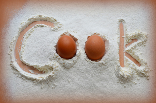 Flour and two eggs - the inscription "Cook" - Photo, Image