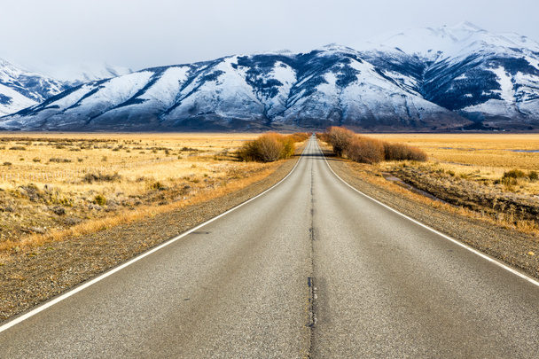 Empty road in El Calafate with snow mountain - Photo, Image