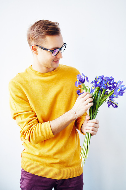 guy with bouquet of blue irises - Фото, изображение