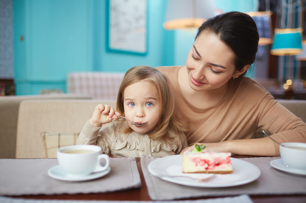 woman and little daughter in cafe - Photo, Image