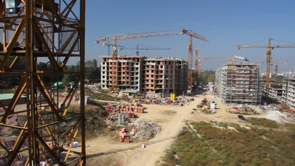 Working cranes near unfinished houses - Footage, Video