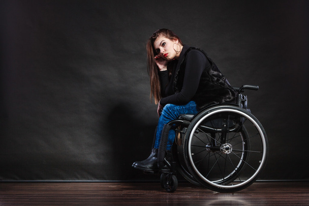 woman sitting on wheelchair - 写真・画像