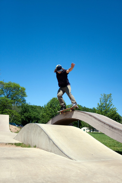 Skateboarder Grinding at the Skate Park - Photo, Image