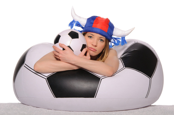 Distressed football cheerleader with ball - Foto, afbeelding