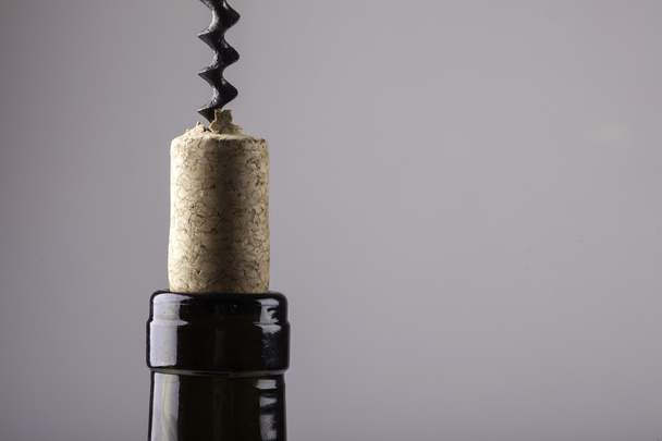 neck of a wine bottle vintage cork and corkscrew - Fotó, kép