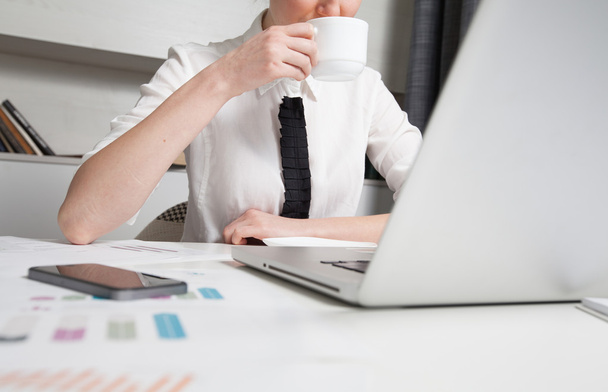 businesswoman on a coffee break. Using laptop computer. - Photo, Image