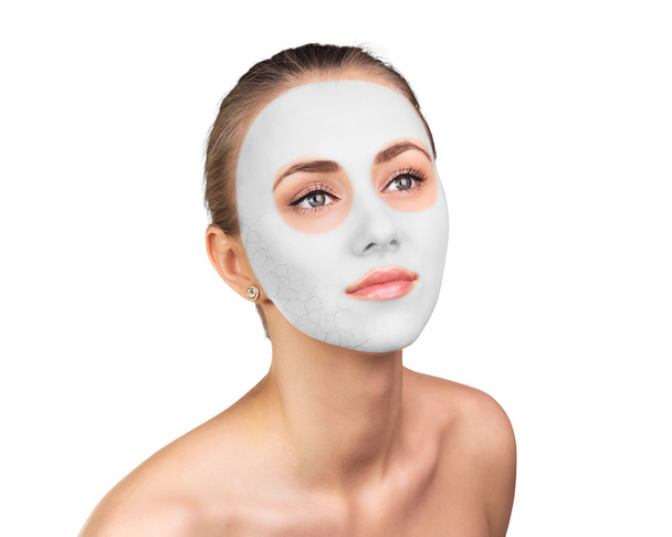 Young woman with clay face mask - Foto, imagen