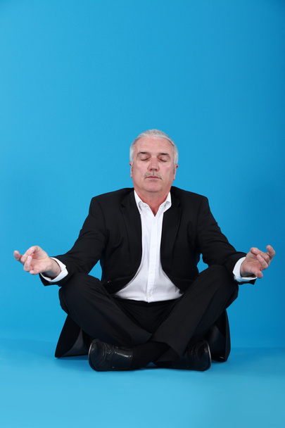 Businessman sitting in a lotus position - Фото, зображення