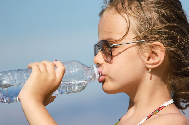 Girl drinking water from the bottle - Photo, Image