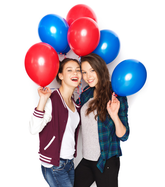 happy teenage girls with helium balloons - Foto, Imagen