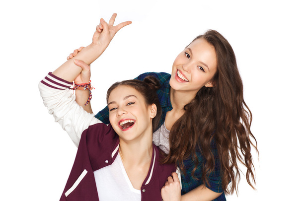 happy pretty teenage girls showing peace hand sign - Fotó, kép