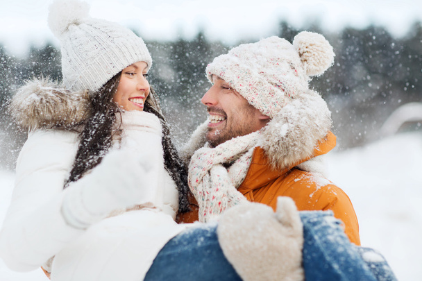 happy couple outdoors in winter - Фото, зображення