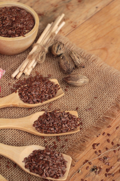 Flax seeds on wood background - Photo, Image