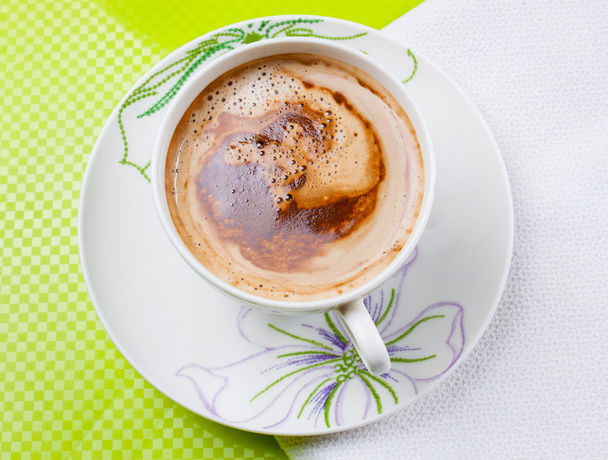 Cup of coffee on white and green background - Foto, imagen