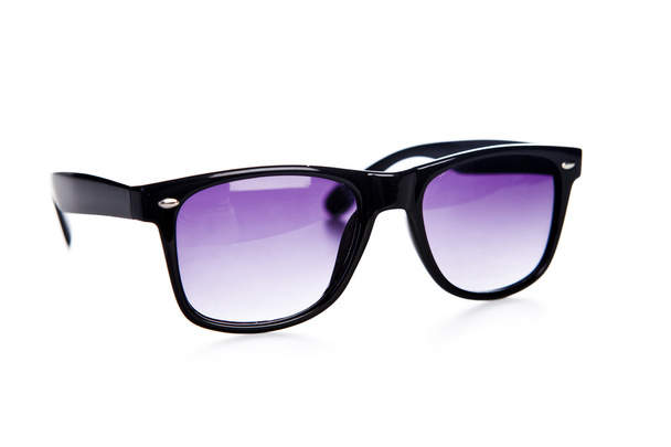 Black sunglasses close up. Isolated on a white  - Fotó, kép