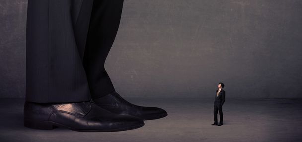 Huge legs with small businessman standing in front concept - Zdjęcie, obraz