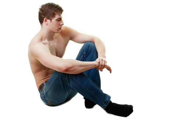 Young man sitting - Foto, afbeelding