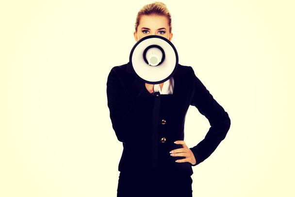 Beautiful businesswoman shouting with megaphone - Foto, Imagem