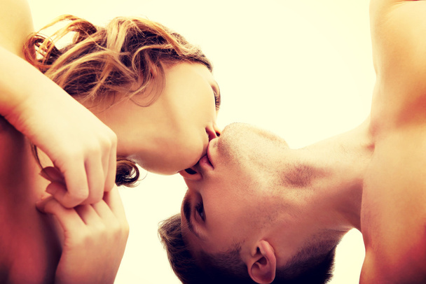 Young couple kissing. - Φωτογραφία, εικόνα