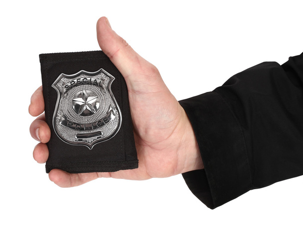 Man hand is holding special police badge - Foto, imagen