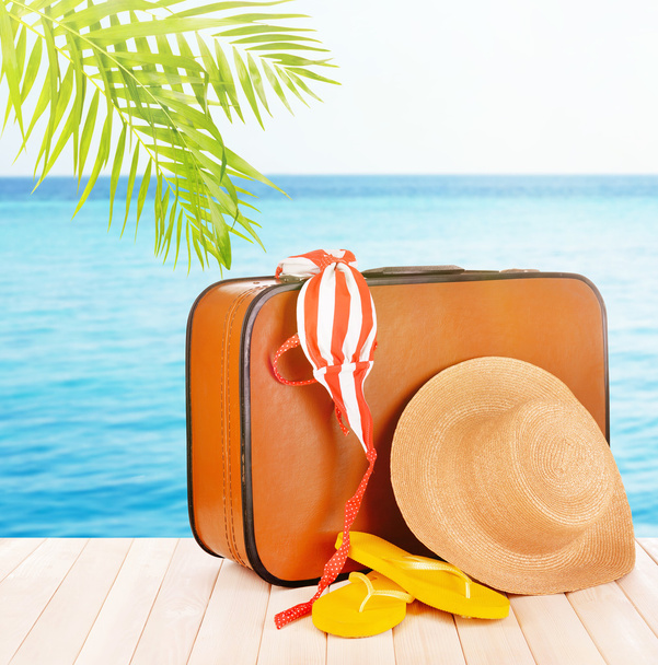 Vintage valise with summer items - 写真・画像