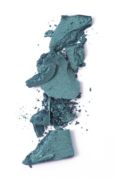 Green color eyeshadow cracked on background - 写真・画像