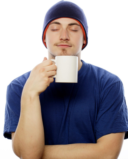 man holding white cup with coffee - Foto, afbeelding
