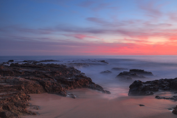 Long exposure at sunset over rocks - Photo, Image
