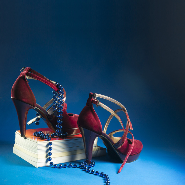 Woman shoes on blue - Foto, afbeelding
