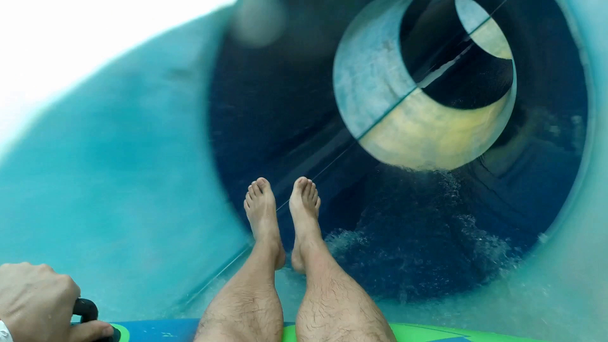 sliding down tube at aqua park - Footage, Video