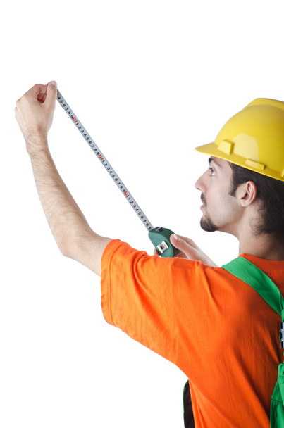 Worker with measuring tape on white - Foto, imagen