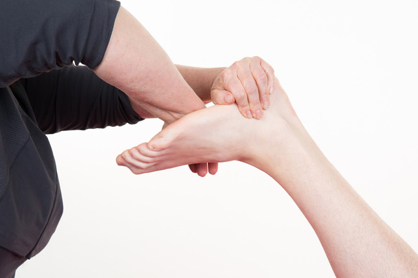 Masseur give reflexology massage on man's foot - Fotografie, Obrázek