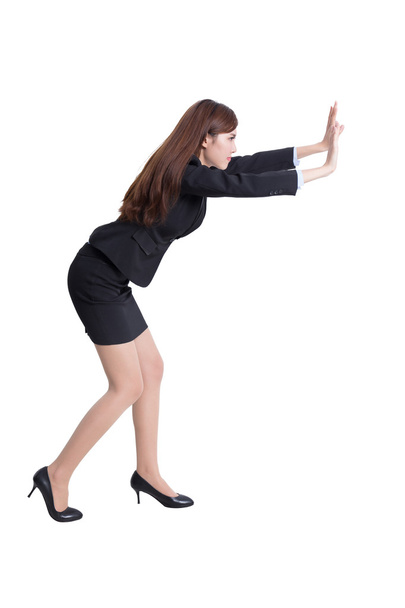 business woman pushing something - Foto, Bild